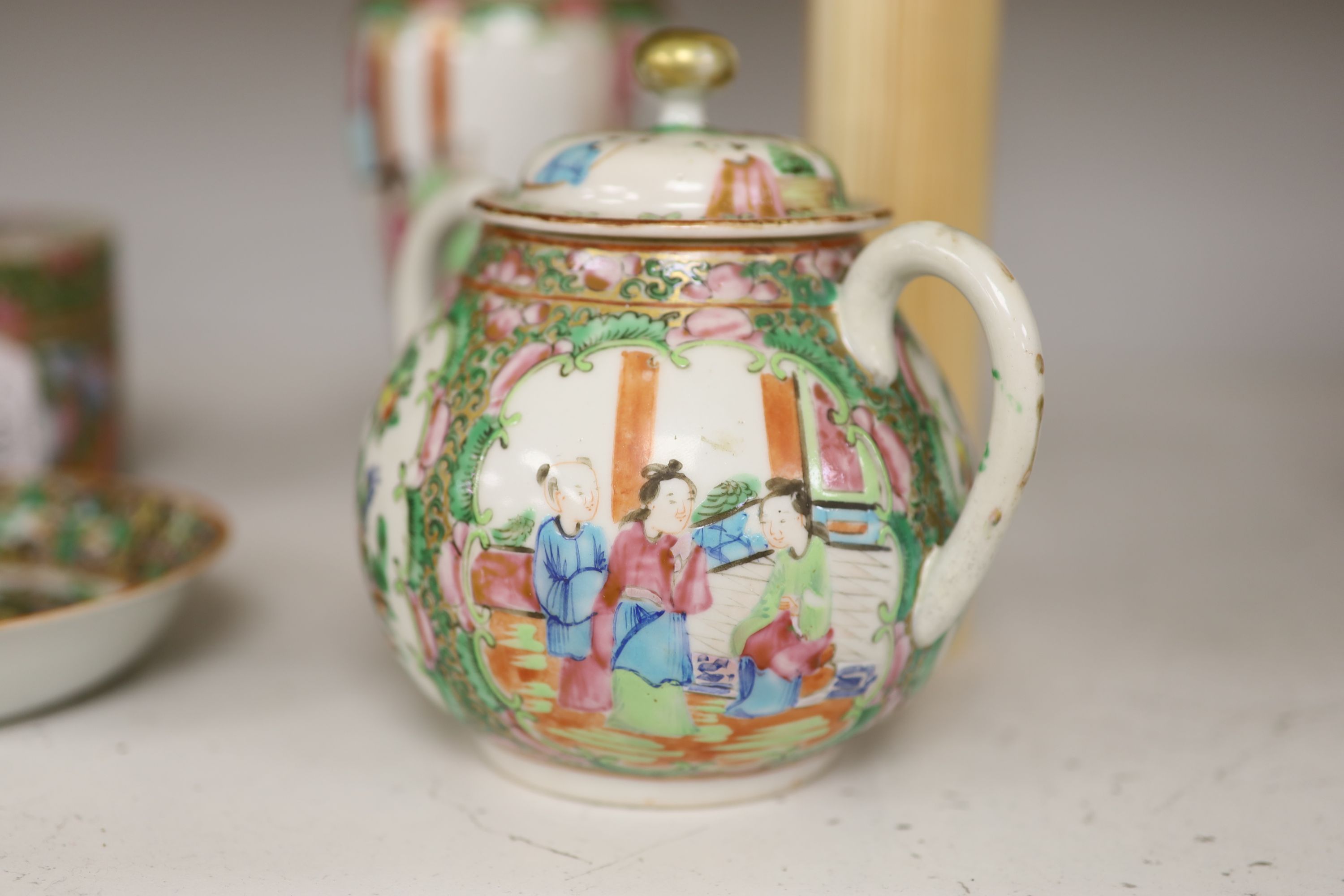 A Chinese famille rose box and cover, two vases, a sugar bowl and cover and a saucer, late 19th/early 20th century, tallest 19cm